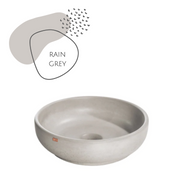 grey round concrete vessel sink